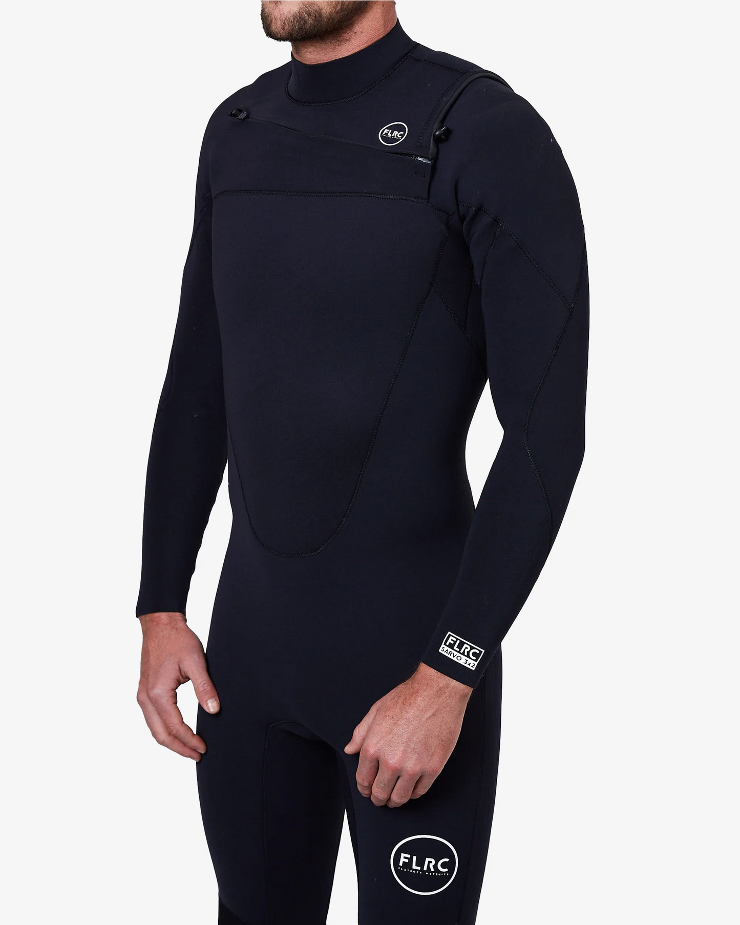 Close-up of black FLRC 3/2mm steamer wetsuit with white logo, showing front detail.