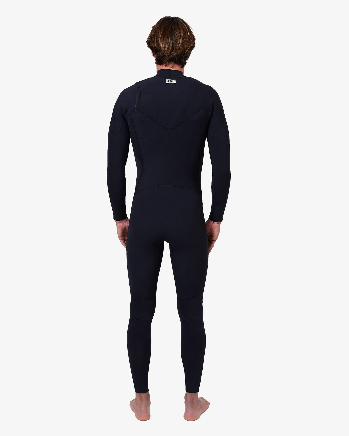 Man wearing black FLRC 3/2mm steamer wetsuit with white logo, back view in studio.