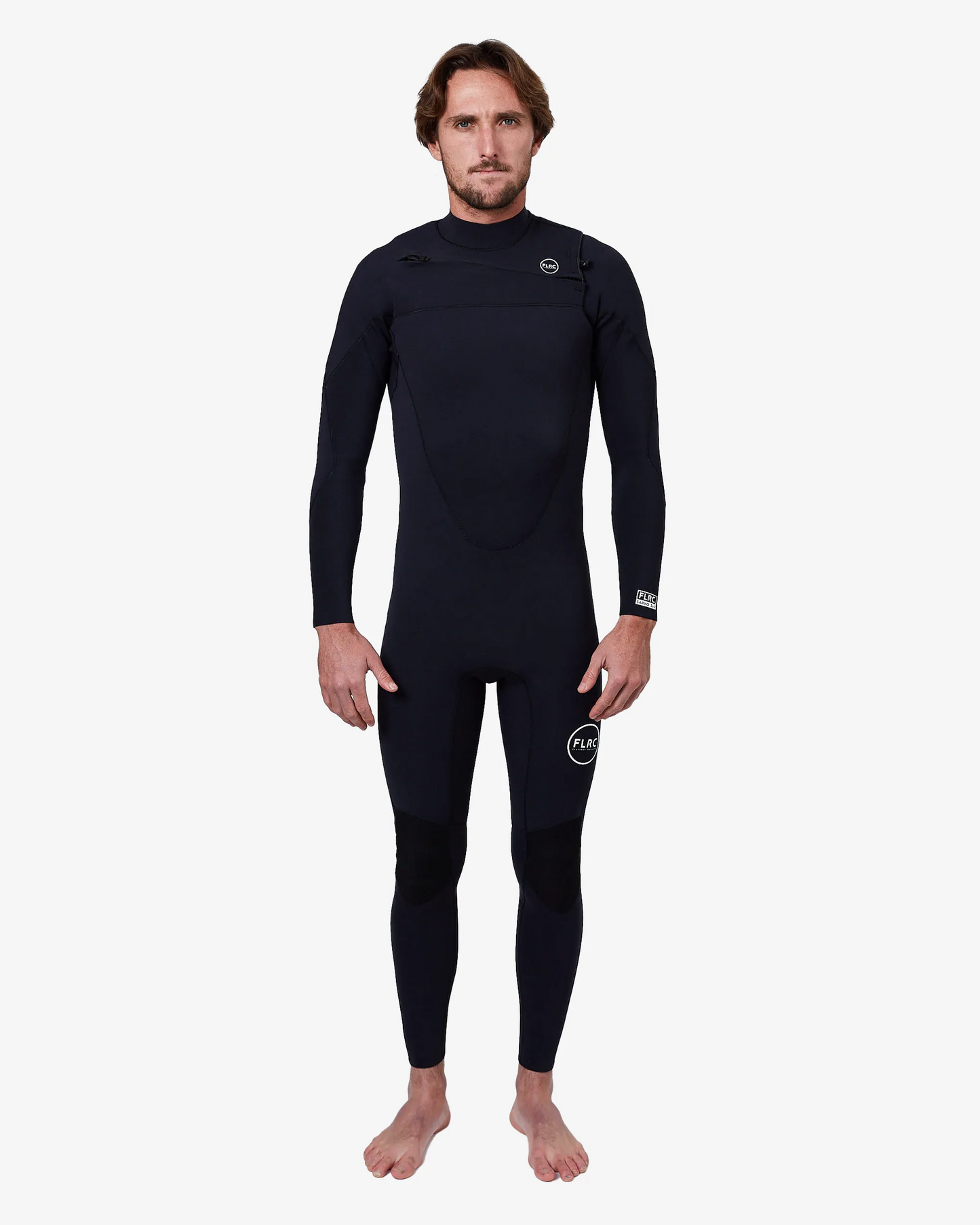 Man wearing black FLRC 3/2mm steamer wetsuit with white logo, front view in studio.