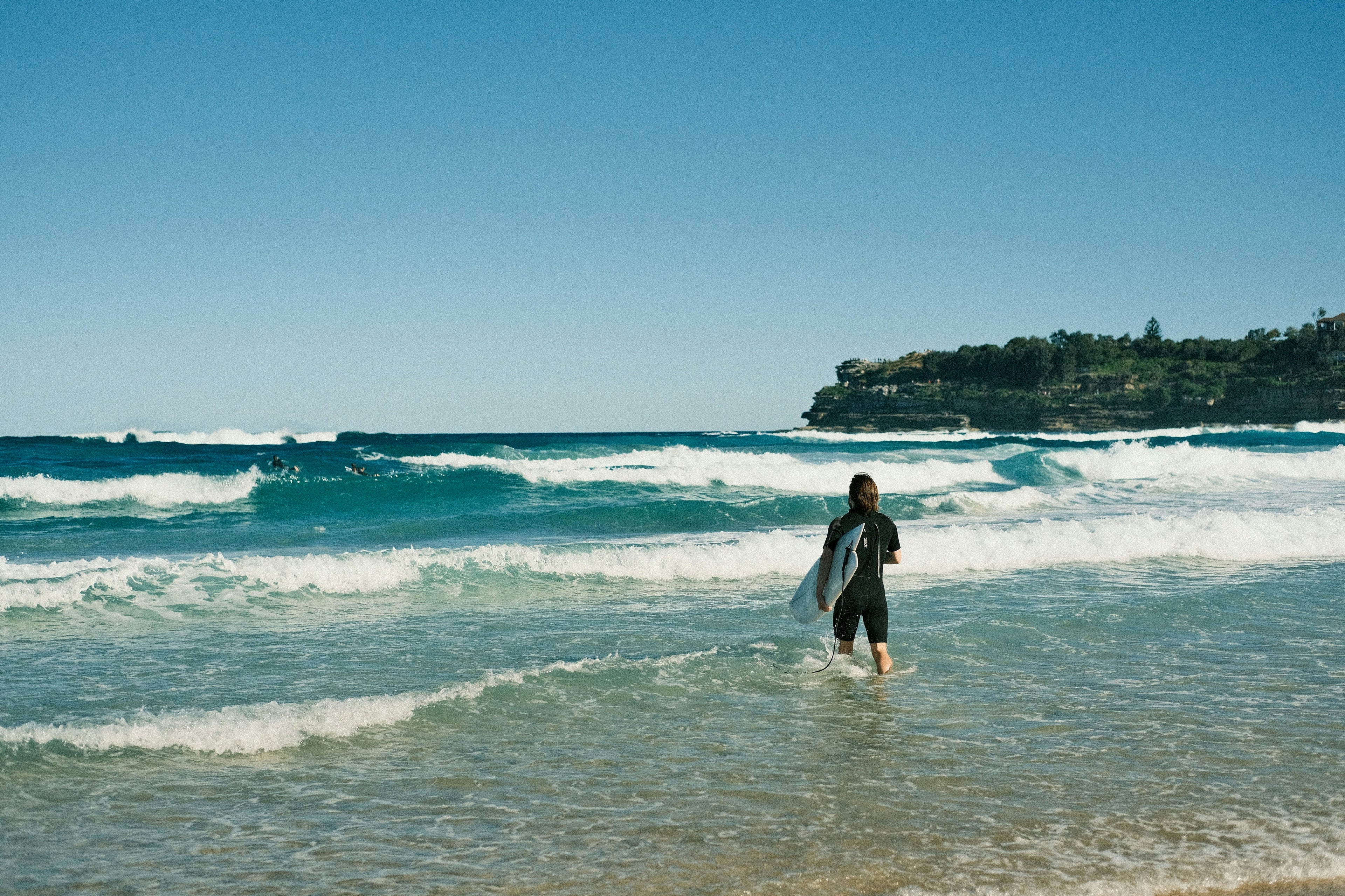 Australian surfer riding a powerful wave at an iconic surf break