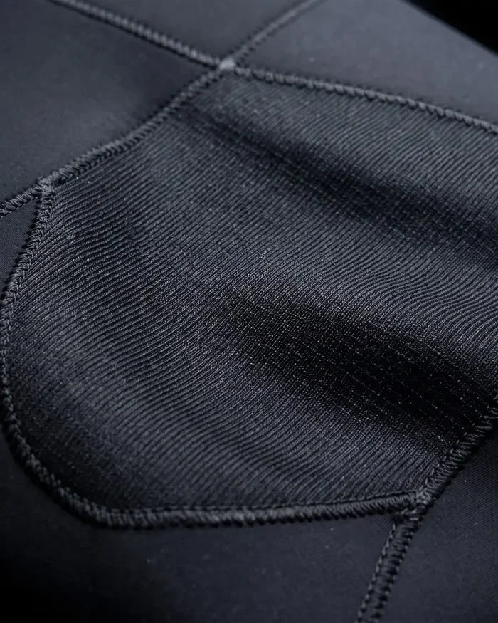 Close-up of the reinforced knee pad and its overlocked edge