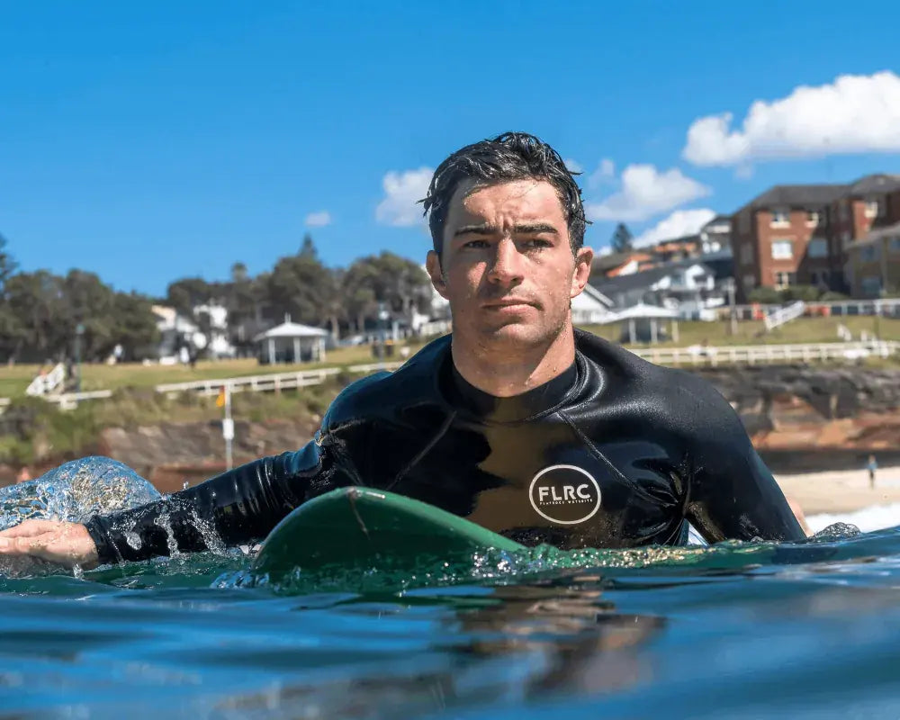 Surfer paddling out at a Sydney beach in the Bronte long sleeve top