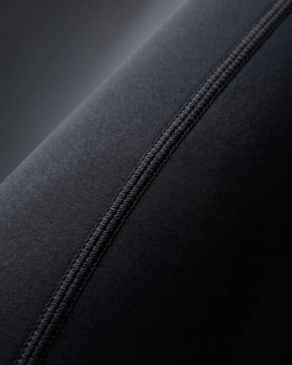 Close-up of a flatlock stitched seam on the Men's 1.5mm Wetsuit Top V2