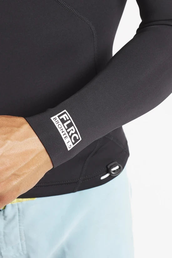 Close-up of the Men's 1.5mm Wetsuit Top V1's wrist cuff label and the toggle at the waist